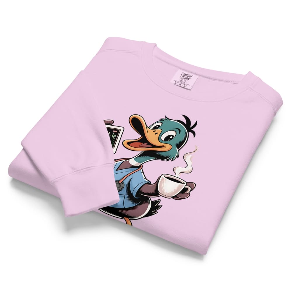 Folded pink sweatshirt with a cartoon duck design on a white background