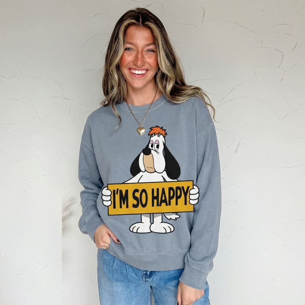 Person wearing a blue sweatshirt with a cartoon character holding 'I'm So Happy' sign against a white background