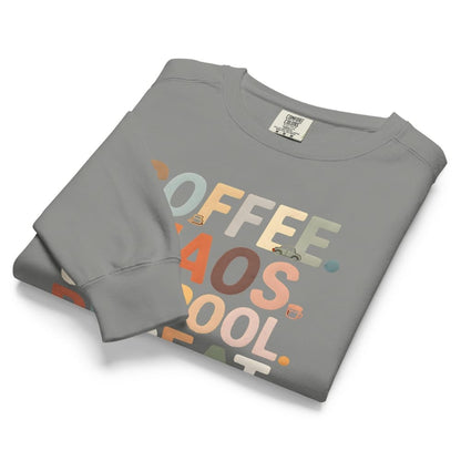 Folded gray sweatshirt with colorful text design on a white background
