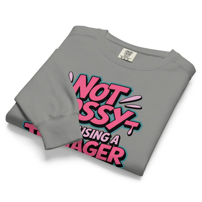 Folded gray sweatshirt with pink and black text on a white background