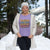 Person wearing a purple shirt with motivational text in a snowy outdoor setting