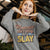 “Mommin' Ain’t Easy But I Slay” retro-style DTG printed design in peach, blue, and yellow on vintage garment-dyed fleece sweatshirt