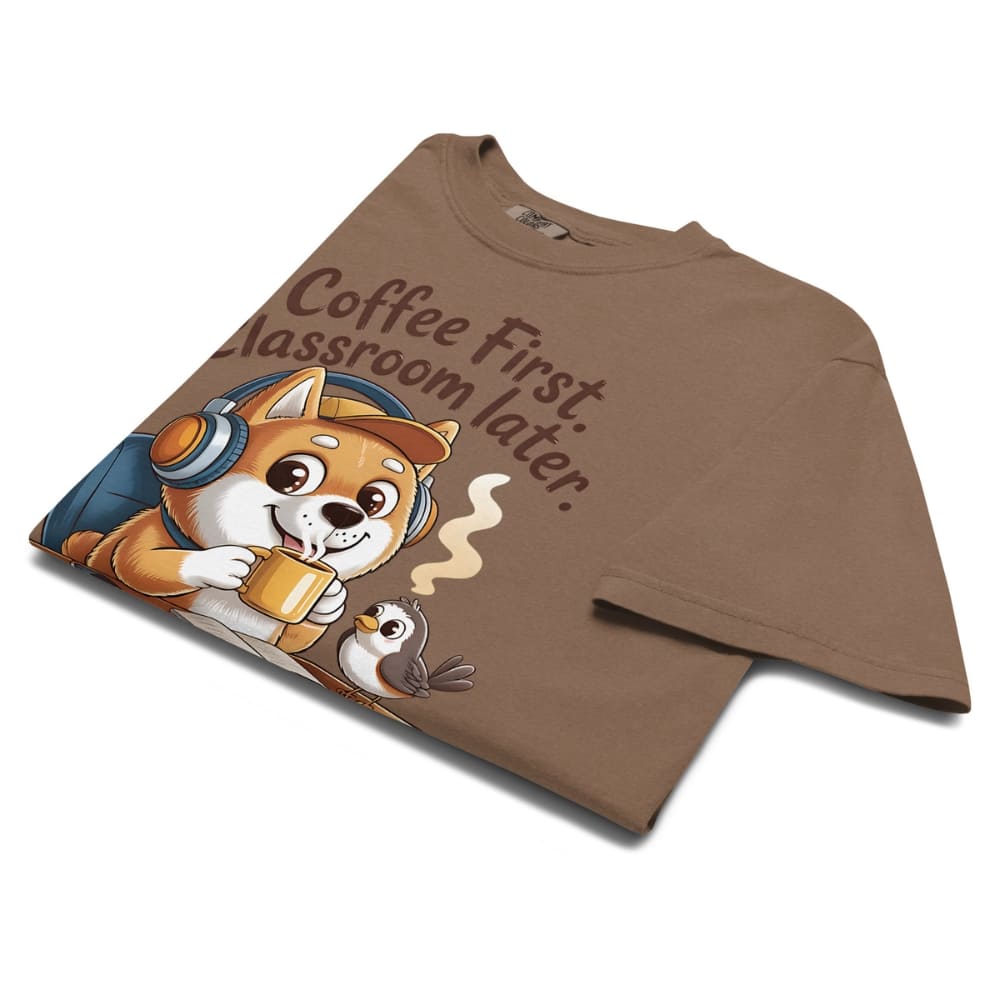 Brown t-shirt with a dog graphic and text 'Coffee First, Classroom Later' on a white background