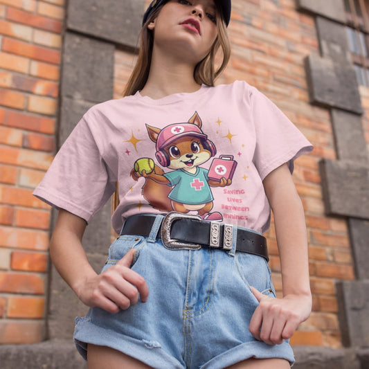 Cute squirrel nurse cartoon in scrubs, pink cap, and headset holding a softball and medical kit with the phrase “Saving Lives Between Innings” — printed on a heavyweight cotton t-shirt