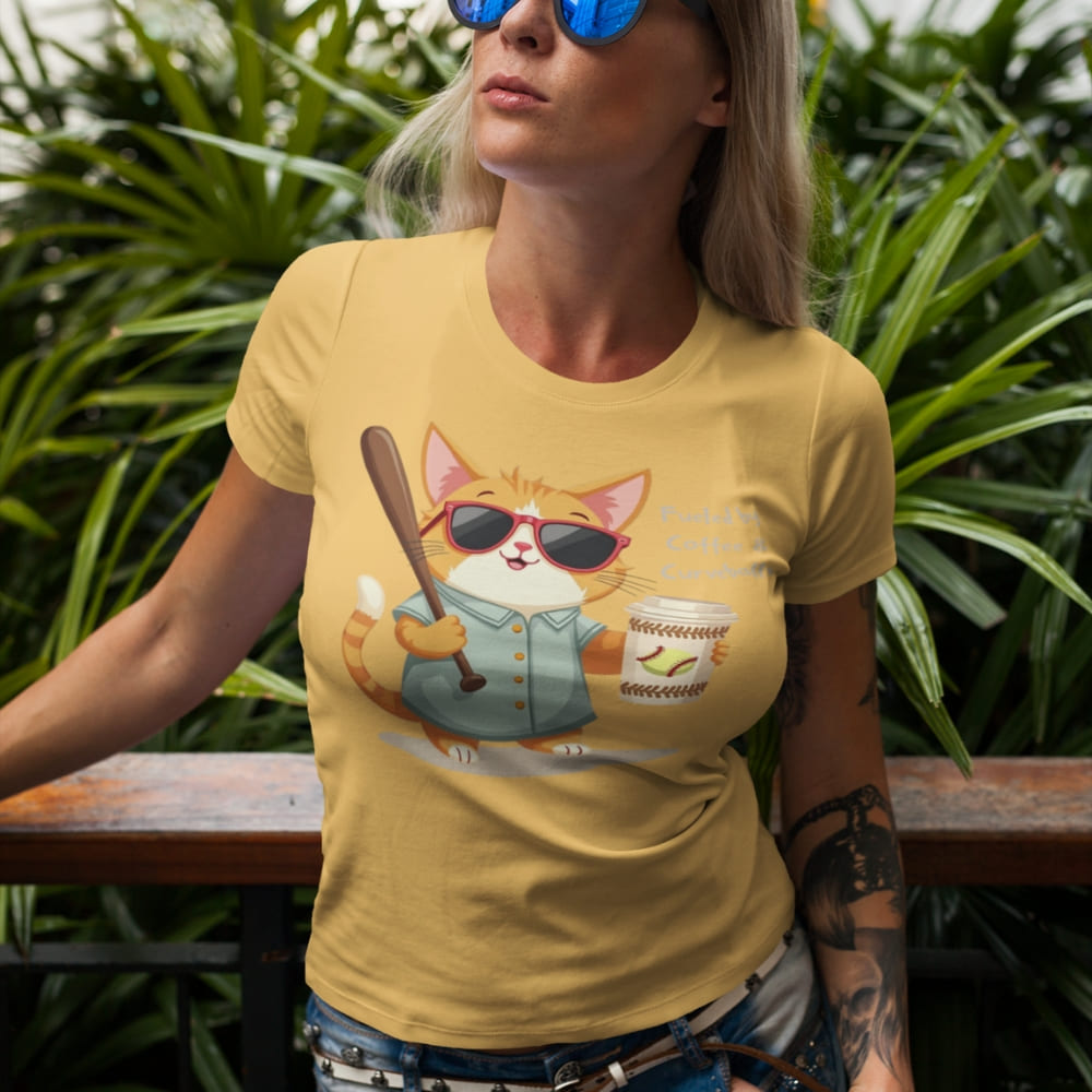 Cool cat with sunglasses holding a softball bat and coffee cup, beside text “Fueled by Coffee & Curveballs” – printed on soft heavyweight t-shirt for sporty moms