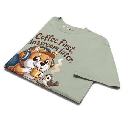 Green t-shirt with a cartoon dog and text 'Coffee First, Classroom Later' on a white background