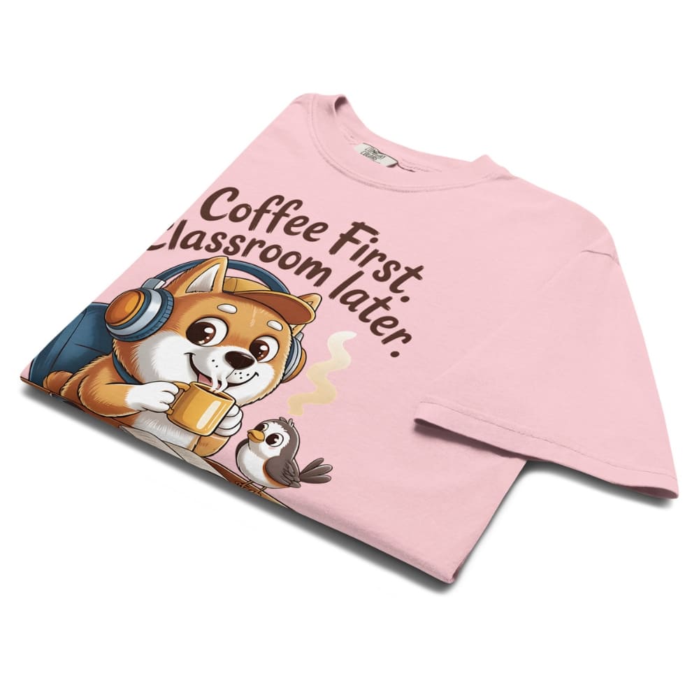 Pink t-shirt with cartoon dog and text 'Coffee First, Classroom Later' on a white background