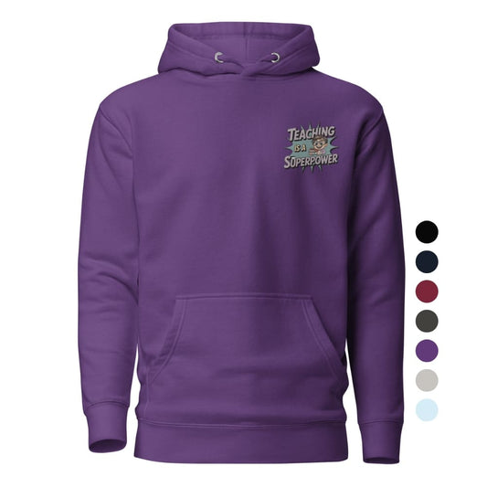 “Cartoon teacher holding books with bold embroidered text ‘Teaching Is a Superpower’ on hoodie – perfect gift for educators”