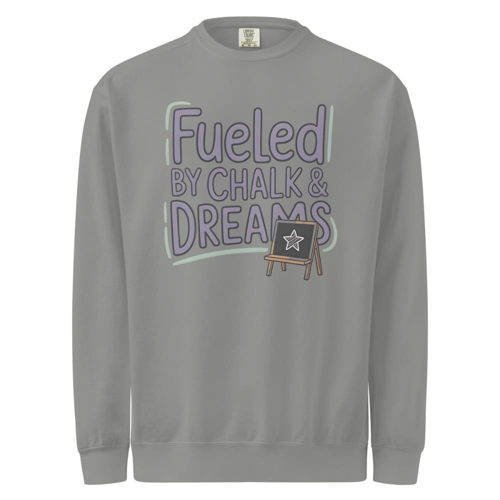 Fueled by Chalk & Dreams printed design on a vintage-style garment-dyed sweatshirt with chalkboard illustration – soft fleece ideal for teachers