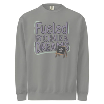 Fueled by Chalk & Dreams printed design on a vintage-style garment-dyed sweatshirt with chalkboard illustration – soft fleece ideal for teachers
