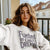 Fueled by Chalk & Dreams printed design on a vintage-style garment-dyed sweatshirt with chalkboard illustration – soft fleece ideal for teachers