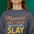 “Mommin' Ain’t Easy But I Slay” retro-style DTG printed design in peach, blue, and yellow on vintage garment-dyed fleece sweatshirt