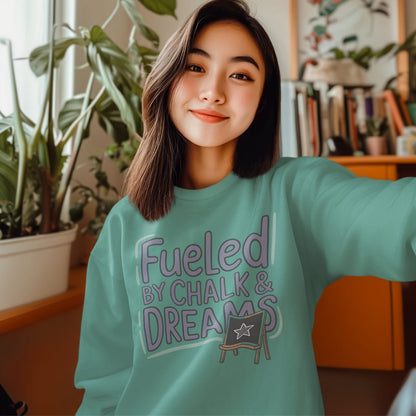 Fueled by Chalk & Dreams printed design on a vintage-style garment-dyed sweatshirt with chalkboard illustration – soft fleece ideal for teachers