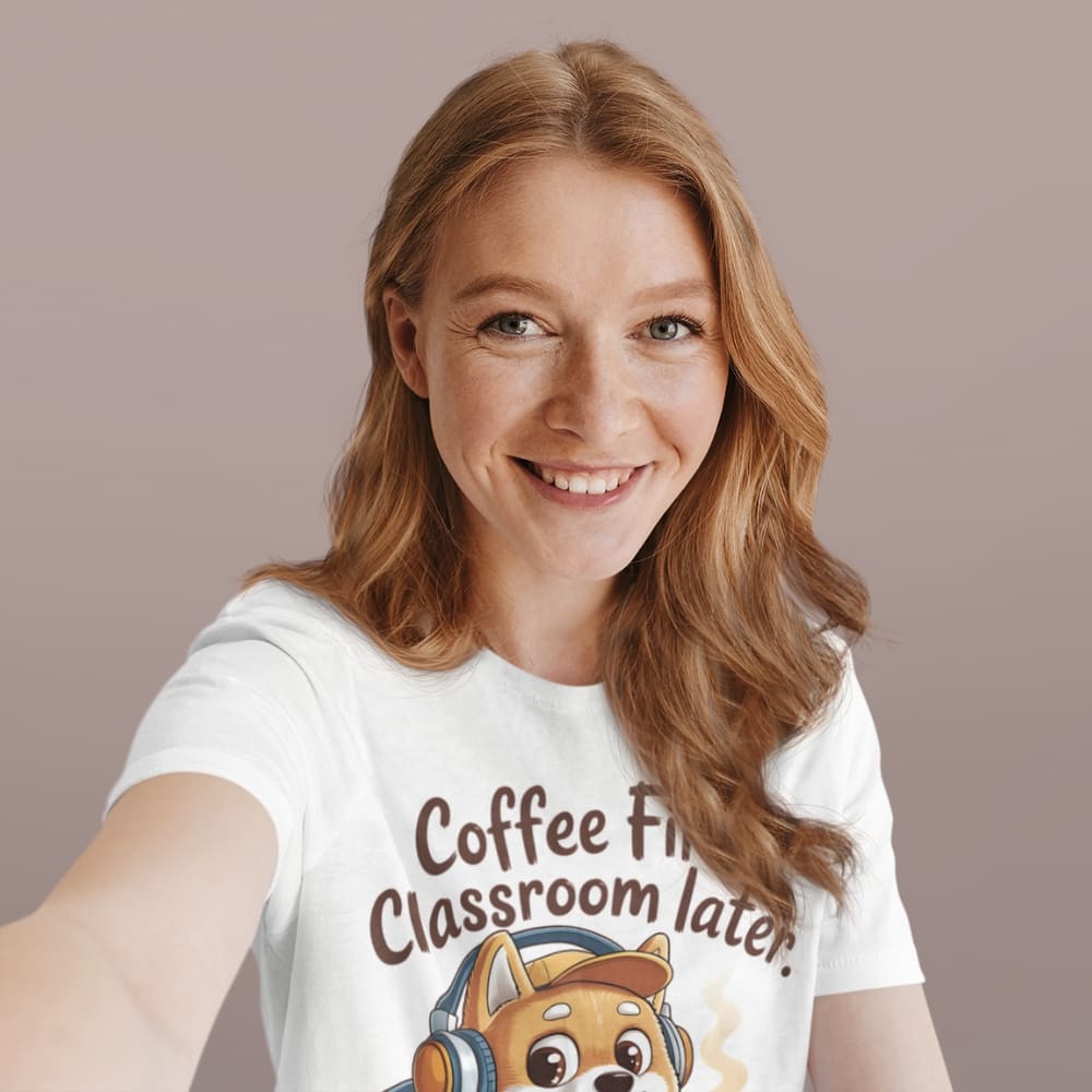 Woman wearing a white t-shirt with a graphic of a dog and text 'Coffee First Classroom Later' on a beige background