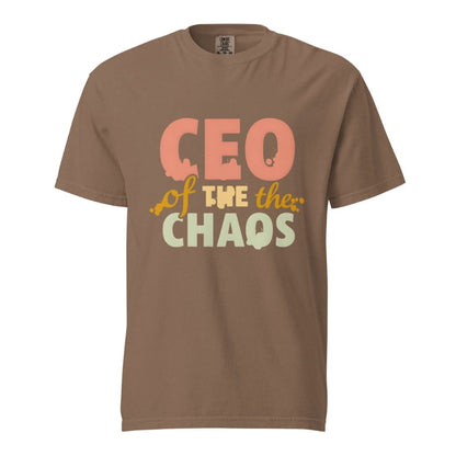 CEO of the Chaos” printed on a heavyweight cotton t-shirt in soft pastel ink, laid flat with a minimal lifestyle background.