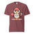 Cute cartoon owl cheerleader holding a pom-pom and clipboard, wearing a red cap with the quote “Behind Every Great Swing Is a Loud Mom” – featured on garment-dyed heavyweight cotton tee