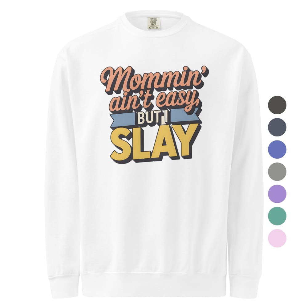 “Mommin' Ain’t Easy But I Slay” retro-style DTG printed design in peach, blue, and yellow on vintage garment-dyed fleece sweatshirt