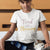 Garment-dyed relaxed fit t-shirt with motivational quote “Tired But Thriving” in modern handwritten script