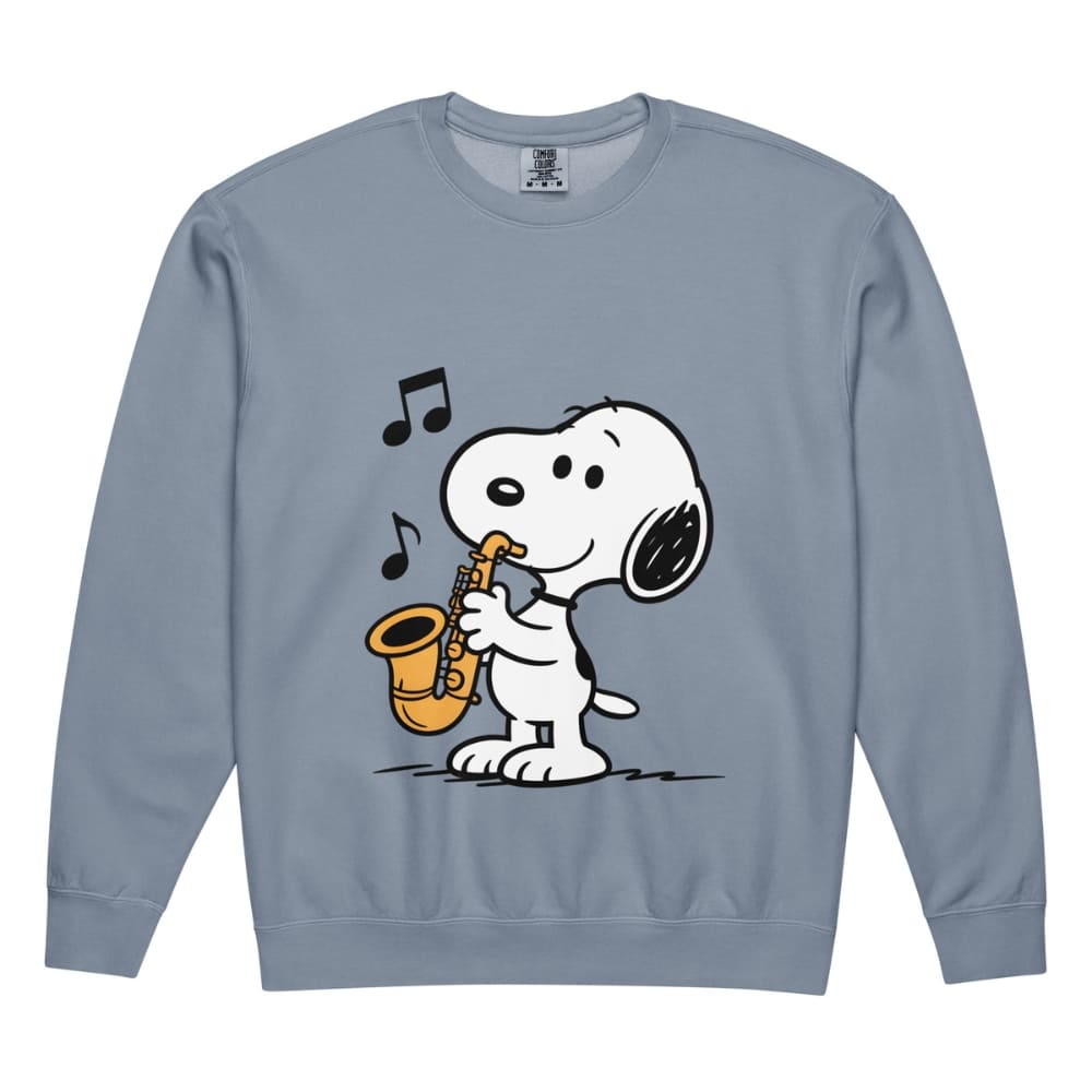 Blue sweatshirt with a cartoon dog playing a saxophone on a white background