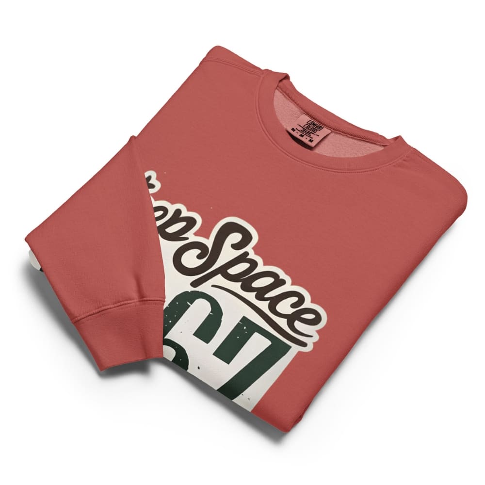 Folded red sweatshirt with 'Keep Space' graphic on a white background