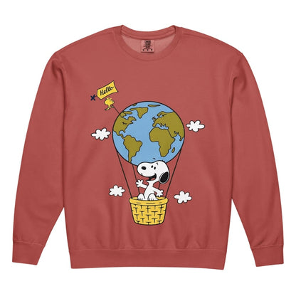 Red sweatshirt with a cartoon design of a dog in a hot air balloon with the Earth, on a white background.