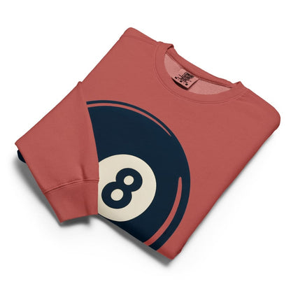 Folded red sweatshirt with an 8-ball design on a white background