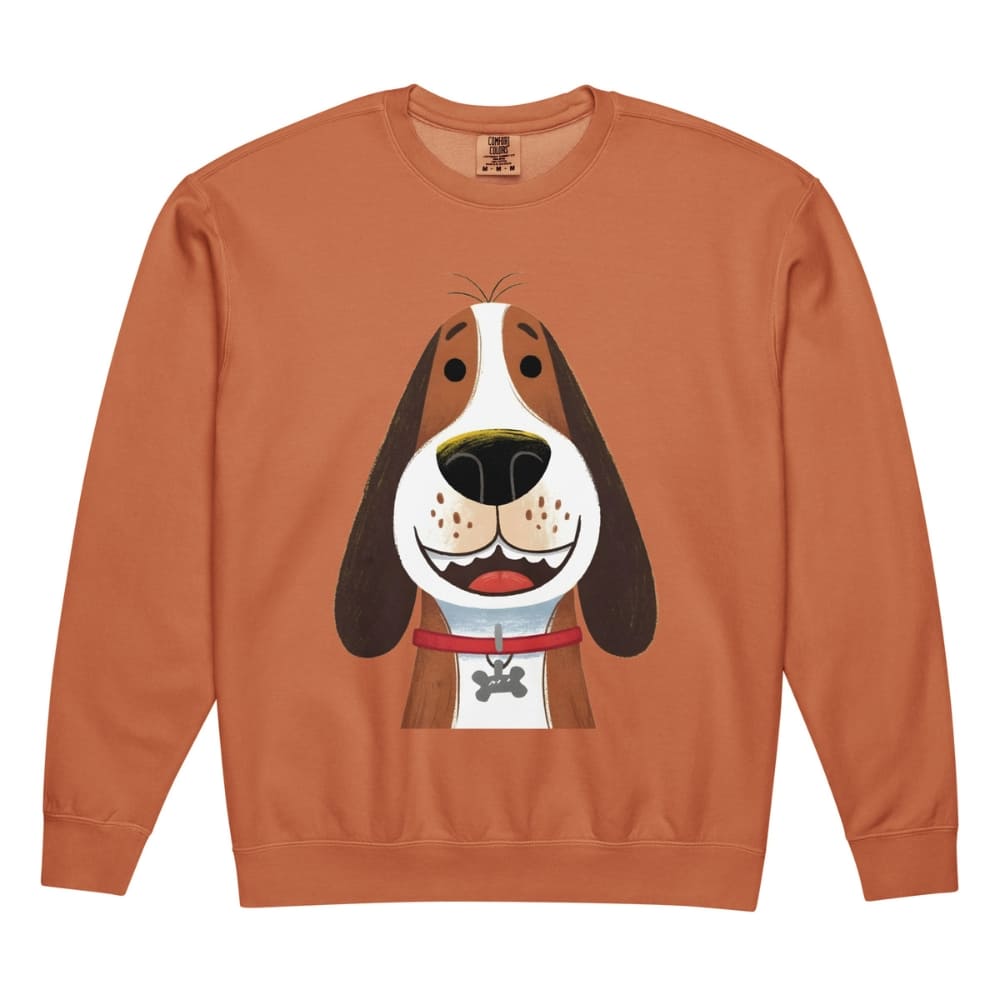 Orange sweatshirt with a cartoon dog design on a white background