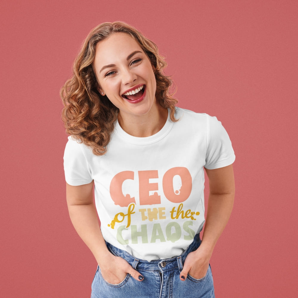 CEO of the Chaos” printed on a heavyweight cotton t-shirt in soft pastel ink, laid flat with a minimal lifestyle background.