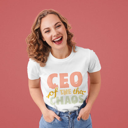 CEO of the Chaos” printed on a heavyweight cotton t-shirt in soft pastel ink, laid flat with a minimal lifestyle background.