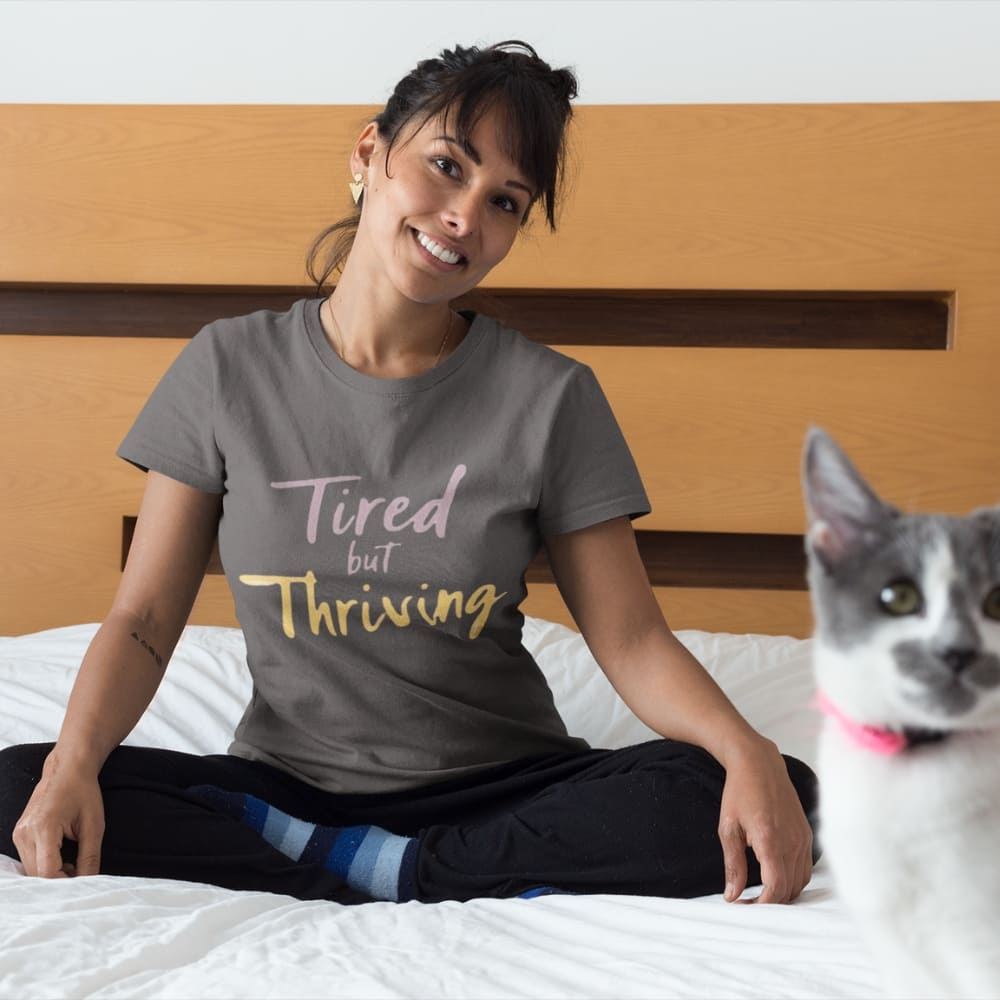 Garment-dyed relaxed fit t-shirt with motivational quote “Tired But Thriving” in modern handwritten script