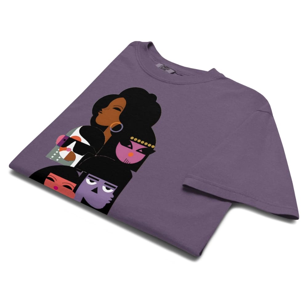 Purple t-shirt with a graphic design of four stylized faces on a white background