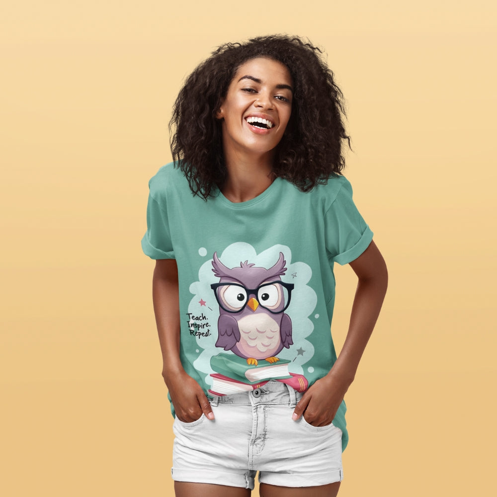 Cute purple owl with glasses sitting on stacked books, with quote "Teach. Inspire. Repeat." – printed on a teacher t-shirt
