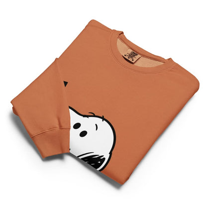 Folded Orange sweatshirt with a cartoon ghost design on a white background