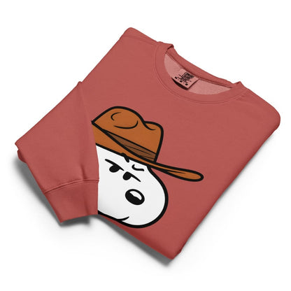 Folded red sweatshirt with a cartoon character wearing a brown hat on a white background