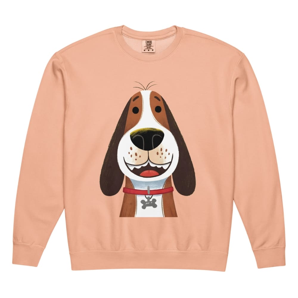 Peach-colored sweatshirt with a cartoon dog design on a white background