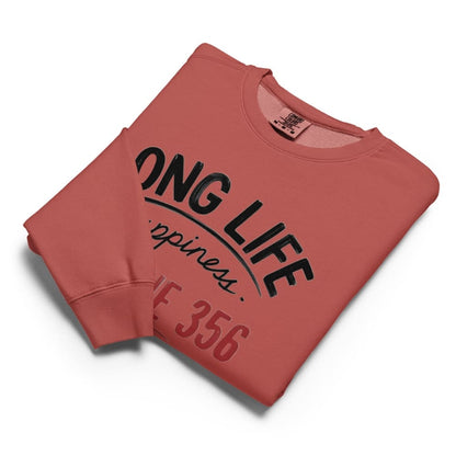 Folded red sweatshirt with black text on a white background