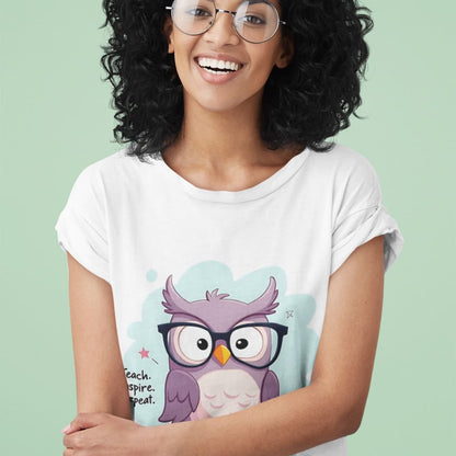 Cute purple owl with glasses sitting on stacked books, with quote "Teach. Inspire. Repeat." – printed on a teacher t-shirt