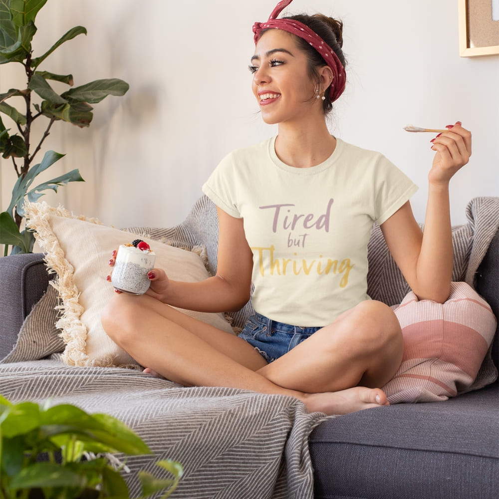 Garment-dyed relaxed fit t-shirt with motivational quote “Tired But Thriving” in modern handwritten script