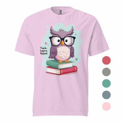 Cute purple owl with glasses sitting on stacked books, with quote "Teach. Inspire. Repeat." – printed on a teacher t-shirt