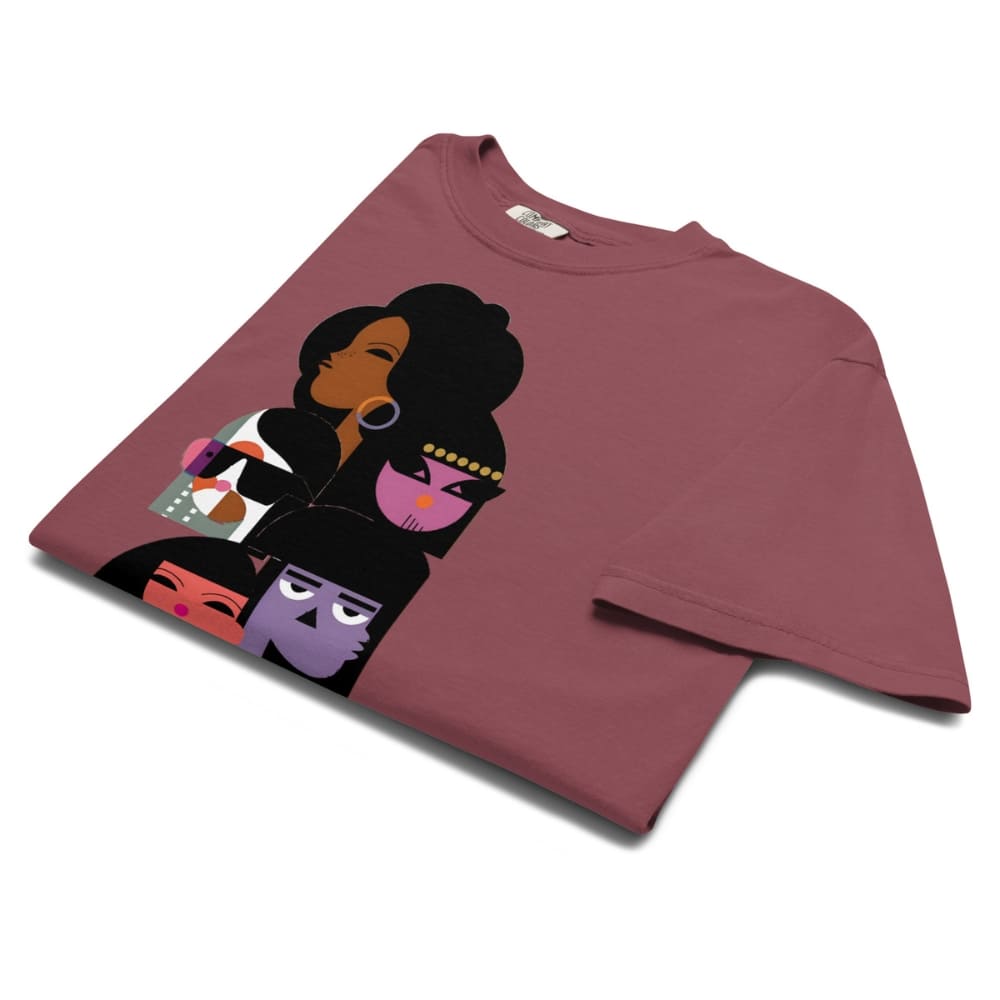 Maroon t-shirt with artistic depiction of faces on a white background