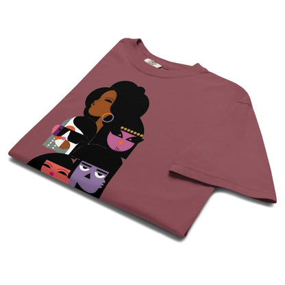 Maroon t-shirt with artistic depiction of faces on a white background