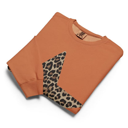 Orange sweatshirt with leopard print sleeve on a white background