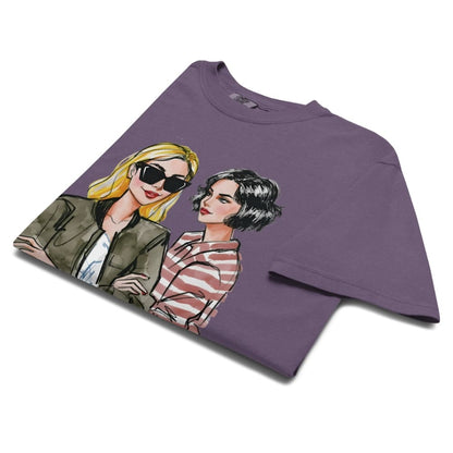 Purple t-shirt with graphic of two women on a white background