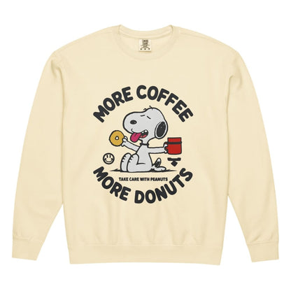 Beige sweatshirt with Snoopy graphic and text 'More Coffee, More Donuts' on a white background