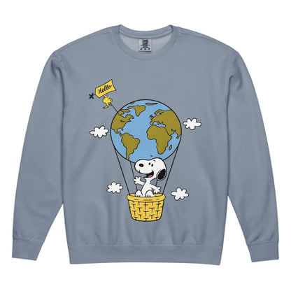 Blue sweatshirt with a cartoon design of Snoopy in a hot air balloon over the Earth.