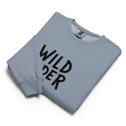 Folded light blue sweatshirt with 'Wild Rider' text on a white background