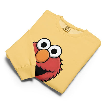 Yellow sweatshirt with a cartoon character face on a white background