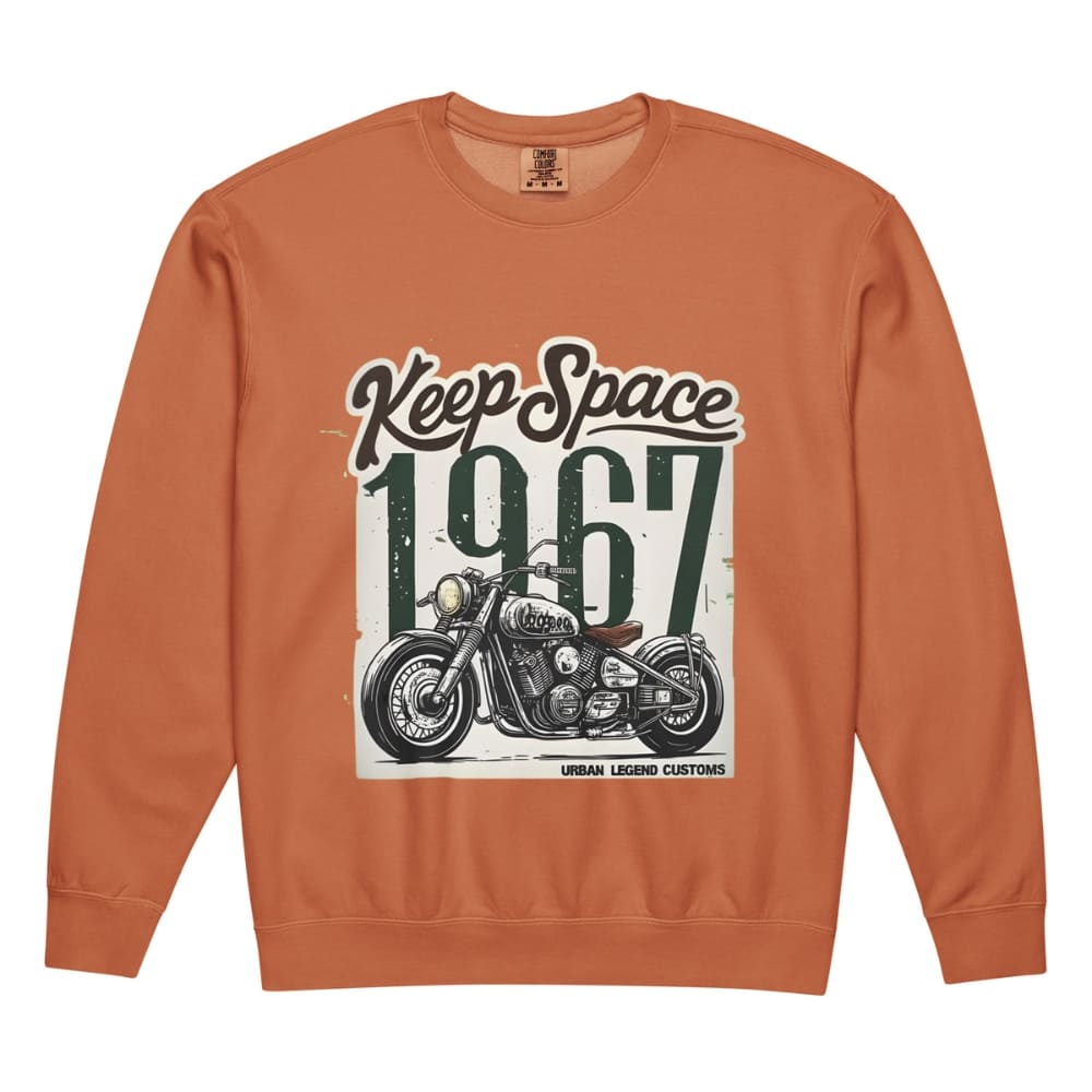 Orange sweatshirt with motorcycle graphic and 'Keep Space 1967' text on a white background