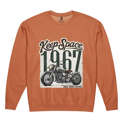 Orange sweatshirt with motorcycle graphic and 'Keep Space 1967' text on a white background