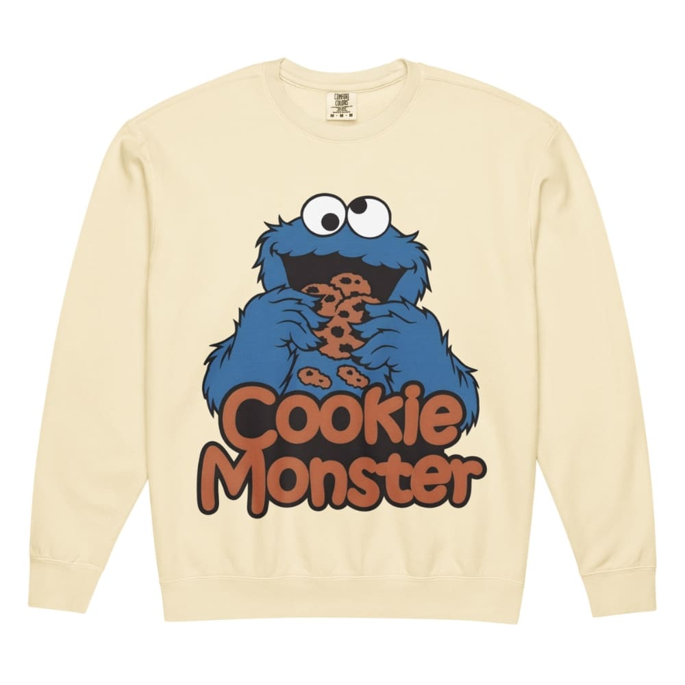 Beige sweatshirt with Cookie Monster graphic on a white background